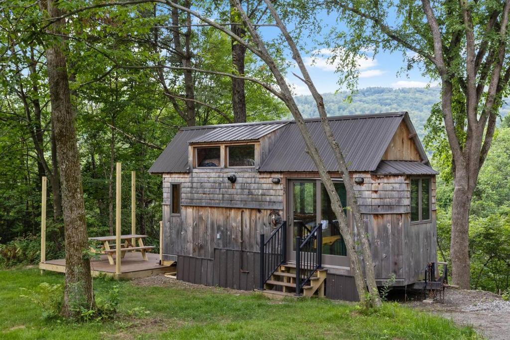 Johnson House | Caboose Tiny Home on river with hot tub near Stowe