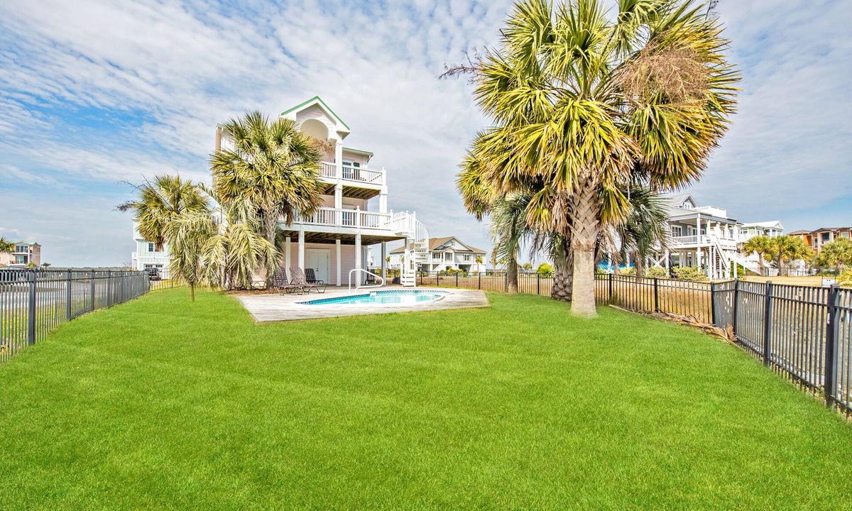 Sunset Beach Cottage | Newly redecorated ocean views, 3 stop elevator, swimming pool deep water canal.
