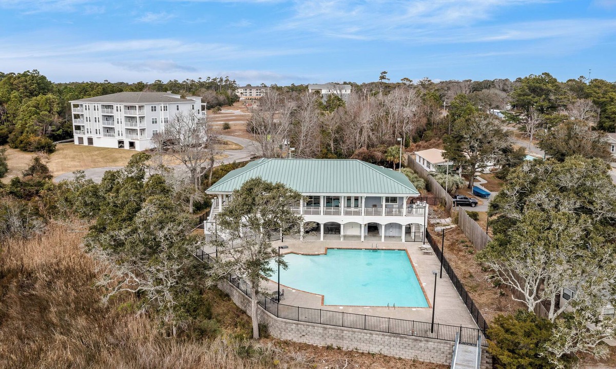 Supply Condo | RELAX in this spacious serene end unit Condo.Pool and dock with club house.