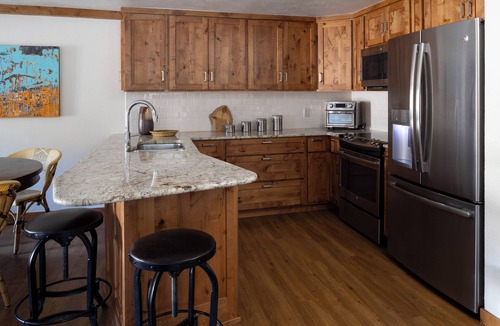 Mount Crested Butte Condo | 4 BDRM, mountain-facing condo, a short walk to the base of Mt. Crested Butte. Two reserved parking spots, a hot tub, sauna, and heated pool.