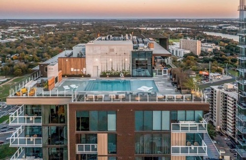 Rainey Street Historic District Apartment | Austin studio condo with WiFi, balcony, W/D, full kitchen, rooftop pool, & gym