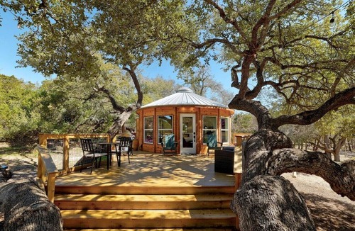 Dripping Springs Cabin | Breathtaking Treehouse Yurt! King Bed and Spa!