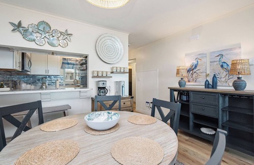 Caswell Beach Condo | By The Ocean Blue: Oceanfront Luxury on Caswell Beach with Community Pool