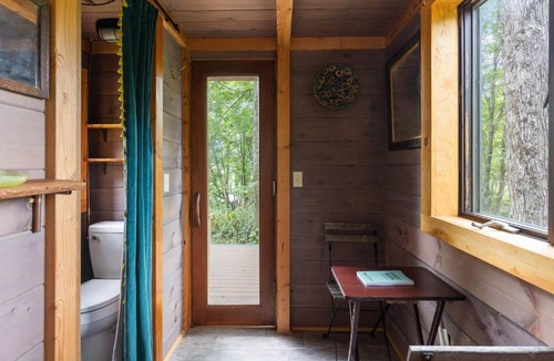 Johnson House | Caboose Tiny Home on river with hot tub near Stowe
