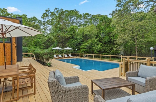 Hampton Bays House | Chic Hampton Bays escape with private heated pool, expansive sundeck, and.