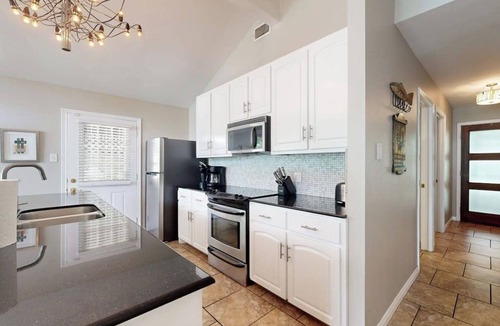 Saratoga Point House | Chic home on Lake Austin with dock, lovely deck, vibrant interior & views