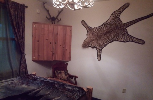 Cohoe Bed & Breakfast | Cozy hunter themed room with hot breakfast