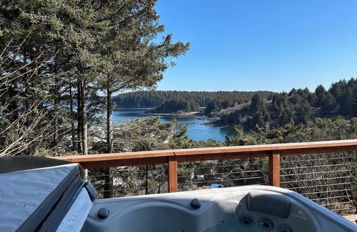 Kodiak House | Enjoy channel views from the hot tub. Minutes walk from downtown and waterfront.