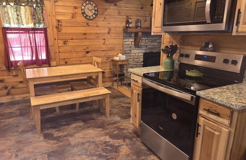 Logan Cabin | Hocking Hills Log Cabin in the Woods facing Rock formation
