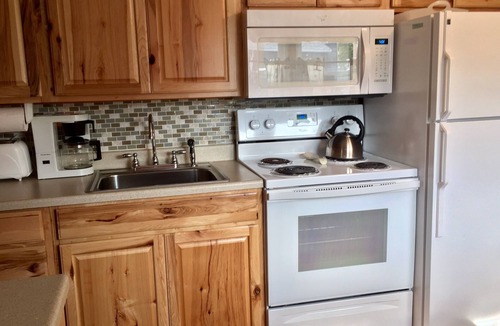 Hampton Cottage | Immaculate Cottage with flower-lined deck located in Island Area! Pet Friendly!
