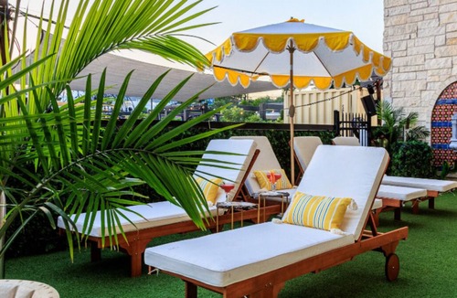 East Cesar Chavez House | Inn Cahoots on 6th: 5BR/13Beds - Pool, Rooftop, Garden Bars, Walk to Everything!