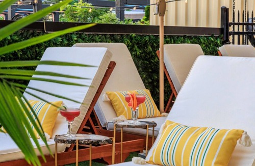 East Cesar Chavez House | Inn Cahoots on 6th: 5BR/13Beds - Pool, Rooftop, Garden Bars, Walk to Everything!