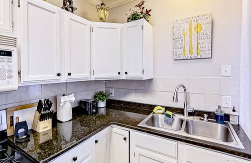 Midtown House | Inviting duplex with full kitchen, patio, central AC, & W/D