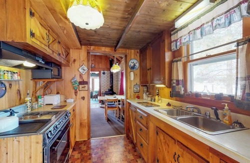 Greenville House | Lakefront cabin with private boat ramp, lake access, wrap-around porch, firepit
