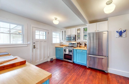 Monmouth House | Lakefront home with private dock, kayaks, firepit, grill, & sunroom