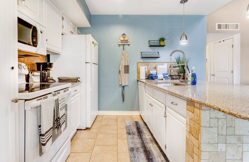Point Venture House | Lovely condo with Olympic-size pool, central AC, balcony, & washer/dryer