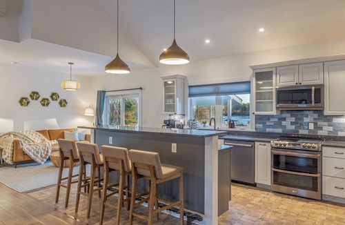 Lamoine House | Oceanfront, mobility-minded home: dock, kayaks, views, hot tub, fire pit + games