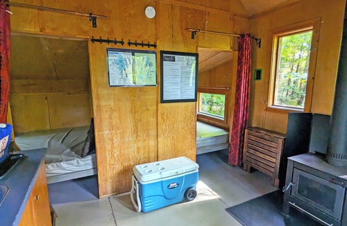 Saint-Faustin-Lac-Carre House | Perched treehouse with a tree growing through the deck | Lodging #08