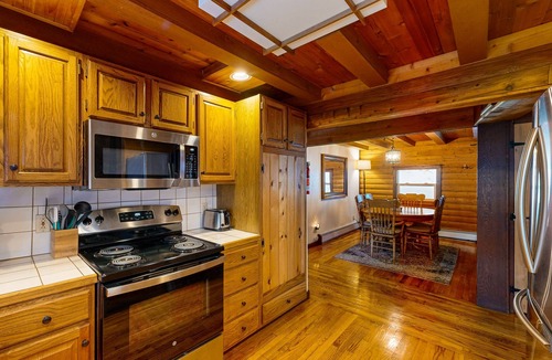 Eagle River House | Picturesque dog-friendly log cabin with stunning views and wood stove