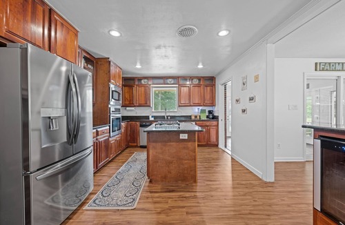 River Bend House | Quiet Riverfront 3BR/2BA house with Spa, Dock, and Golf Carts