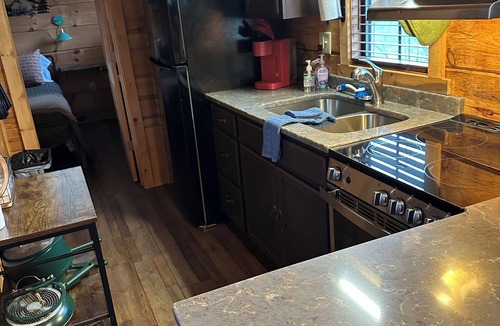 Altamont Cabin | Riverfront Escape: Fire Pit, private hot tub, river fun, sleeps 6