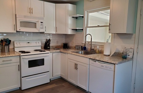 Tranquil Harbour House | Sandy Paws - A Dog-Friendly Haven with Boat Parking on Oak Island, NC