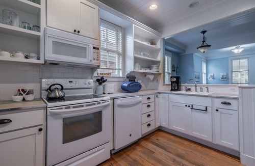 Seabrook House | Seabrook's Cape Escape a cozy 2-bedroom home with a covered porch!
