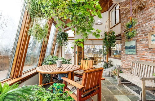Rabbit Creek House | Secluded retreat with lush sunroom, scenic deck, fireplace & W/D