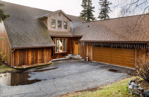 Rabbit Creek House | Secluded retreat with lush sunroom, scenic deck, fireplace & W/D
