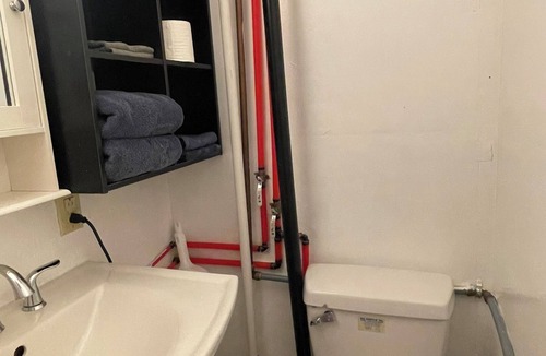 Fairbanks Apartment | Studio with a Queen bed, shower cabin and toilet, shared access to free laundry