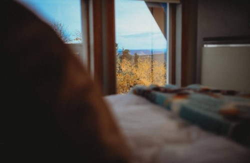 Fairbanks Ski Chalet | This A-frame is surrounded by mountain ranges that you can enjoy from the many windows