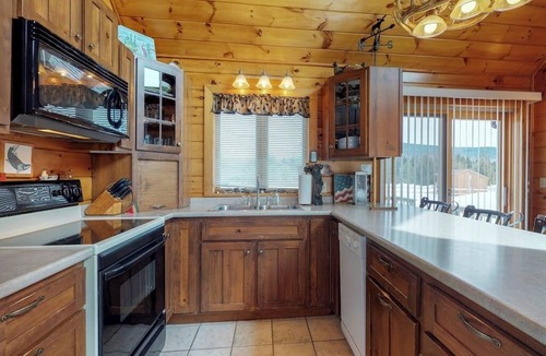 Greenville House | Two lakefront dog-friendly cabins on four acres with porches, dock, & lake views