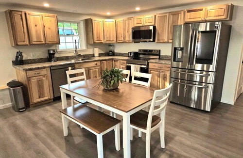 Hartford House | Unwind in lakeside luxury; your serene Bear Pond escape awaits.