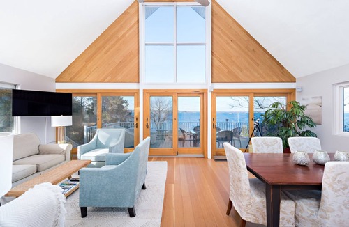 Jamestown Shores House | Waterfront A-frame Chalet with shore beach overlooking Narragansett Bay