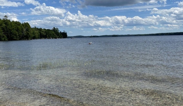 Beautiful private beach area within steps from the modern updated log home