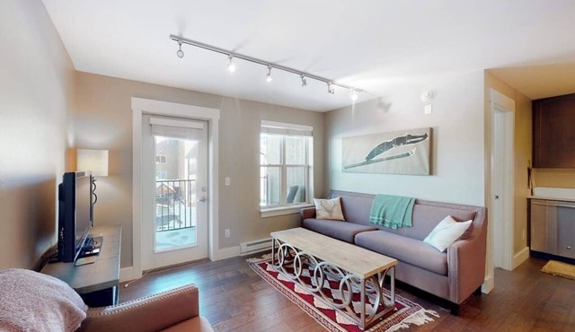 Comfortable condo with sweeping mountain views, private balcony, & washer/dryer