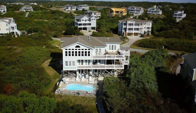 Full Circle is a beautiful coastal retreat nestled in the private east-end community of Dunescape