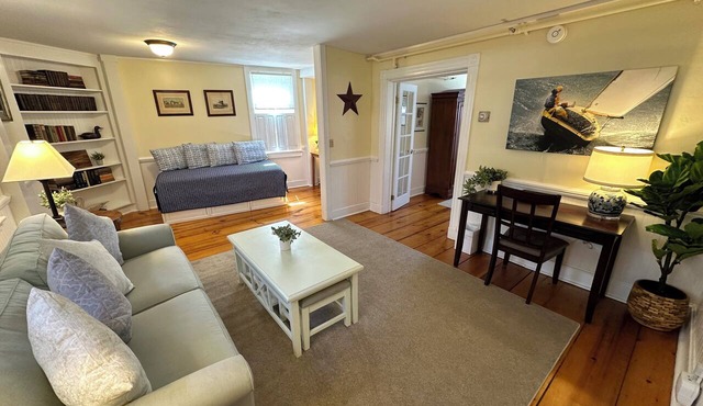 Get ready for downtown Newport RI bliss in this airy three-room suite at 205 Spring St! King bed + pull-out sofa & daybed, ensuite bath, living area, AC, highs speed Wifi, TV, mini fridge, coffee station. Steps to Thames Street, shops, wharfs