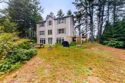 Idyllic waterfront home with furnished deck, grill, sweeping views & private W/D