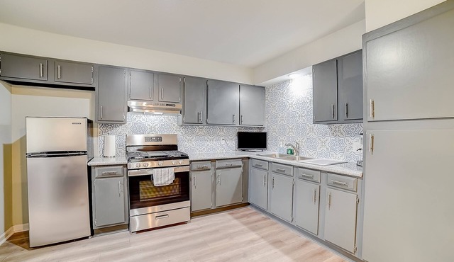 Inviting home with heated pool, enclosed yard, central AC, & W/D - dog-friendly