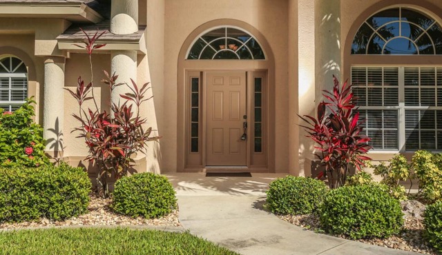 Medalist - Stunning lake side home with pool