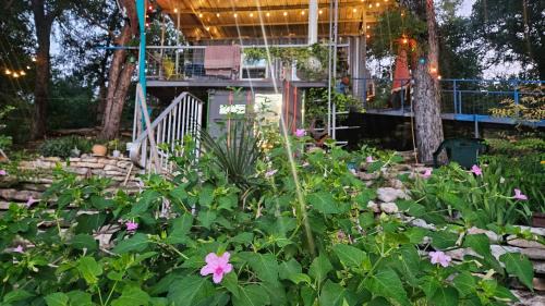 Pickles Place is a Stacked container home in the Texas Hill Country this space is surrounded by giant Elm trees lush greenery across the street from the San Gabriel river one double bed full size shower & full kitchen plus BBQ pit & flategrill