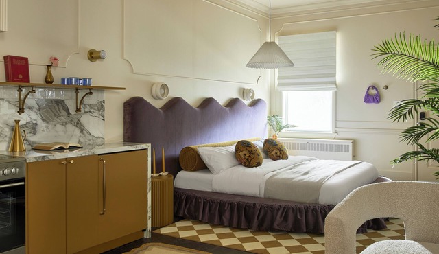 This neutral flat packs a punch with a unique and interesting feature—a round king size bed! in Stratford