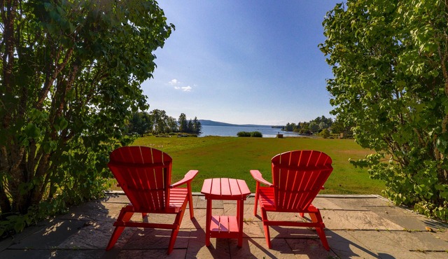 Two lakefront dog-friendly cabins on four acres with porches, dock, & lake views
