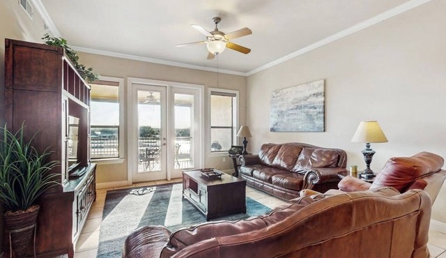 Waterfront condo with furnished balcony, central AC, & washer/dryer